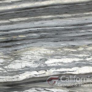 Close-up of marble slab with white, gray, and black linear veining.