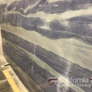 Blue and white marble slab with swirling patterns.