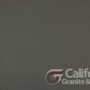 Gray granite stone surface with California Granite & Marble logo.