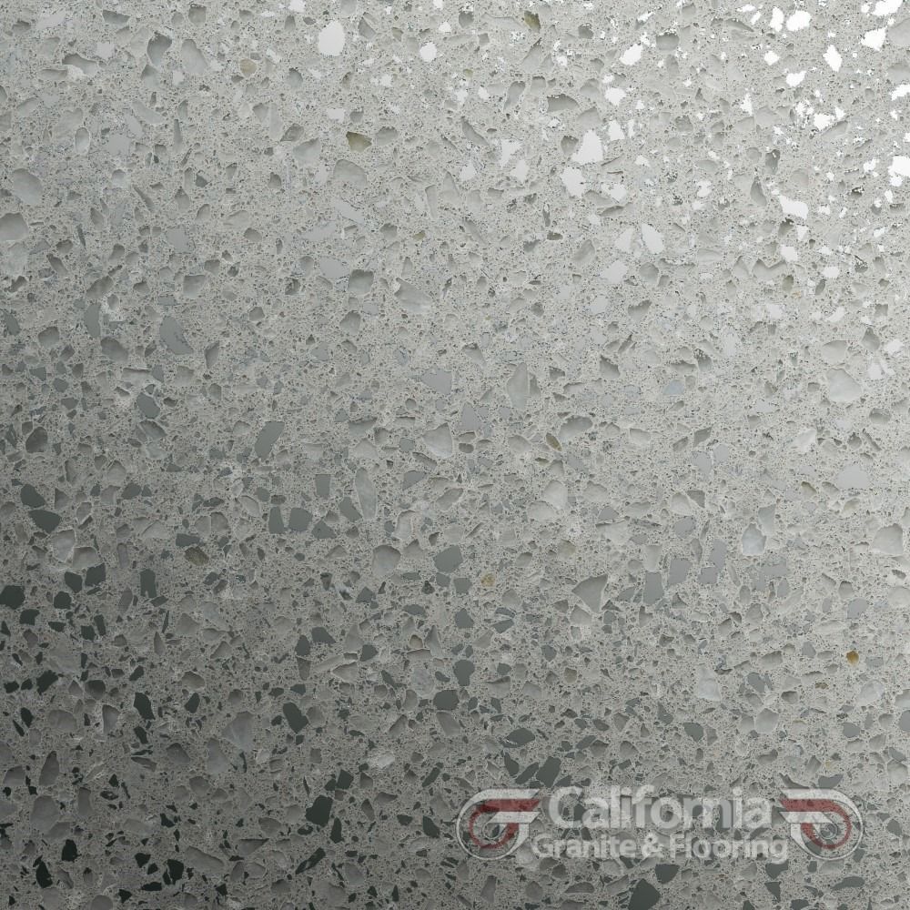 Close-up of light gray terrazzo tile with specks and flecks.