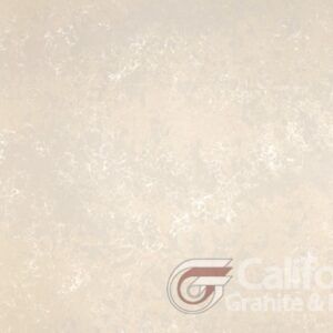 Cream-colored quartz countertop with subtle veining, possibly for kitchen or bathroom use.