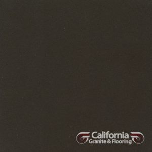 Dark gray flooring sample with the California Granite & Flooring logo.