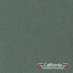 Textured, solid dark green quartz countertop sample with the logo of California Granite & Flooring.