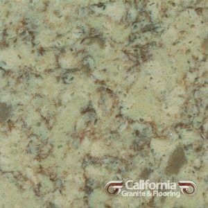 Close-up of speckled quartz countertop with shades of beige, brown, and green.