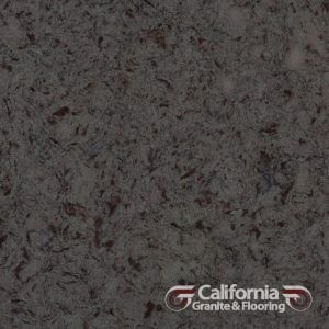 Gray countertop with dark specks and the California Granite & Flooring logo.