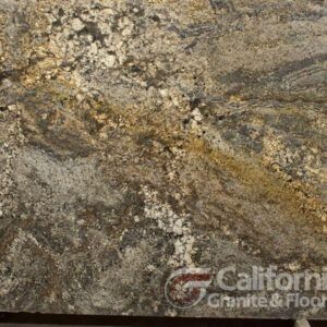 Close-up of granite slab with swirls of brown, gold, and gray, with a