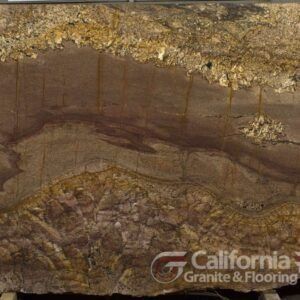 Close-up of a brown and gold granite slab with unique, wave-like patterns.