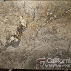 Granite slab with a swirling pattern in shades of beige, gray, and gold. The slab has natural variations and textures.