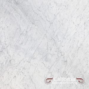 White marble with gray veining, suitable for flooring or countertops. The surface is mostly white with soft, swirling gray lines.