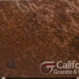 Red-brown stone slab with swirling patterns and a logo from California Granite & Marble.