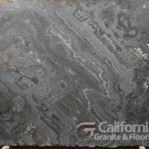 Gray marble slab with swirling patterns and light veining, likely for countertops. California Granite & Floors logo in the bottom right.