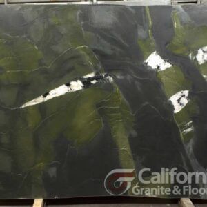 Large slab of green, black, and white marble with California Granite & Floors logo in the bottom right corner.