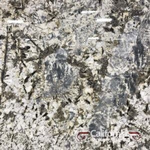 Granite countertop with a mottled pattern of white, gray, and black. It has a speckled appearance with some dark streaks.