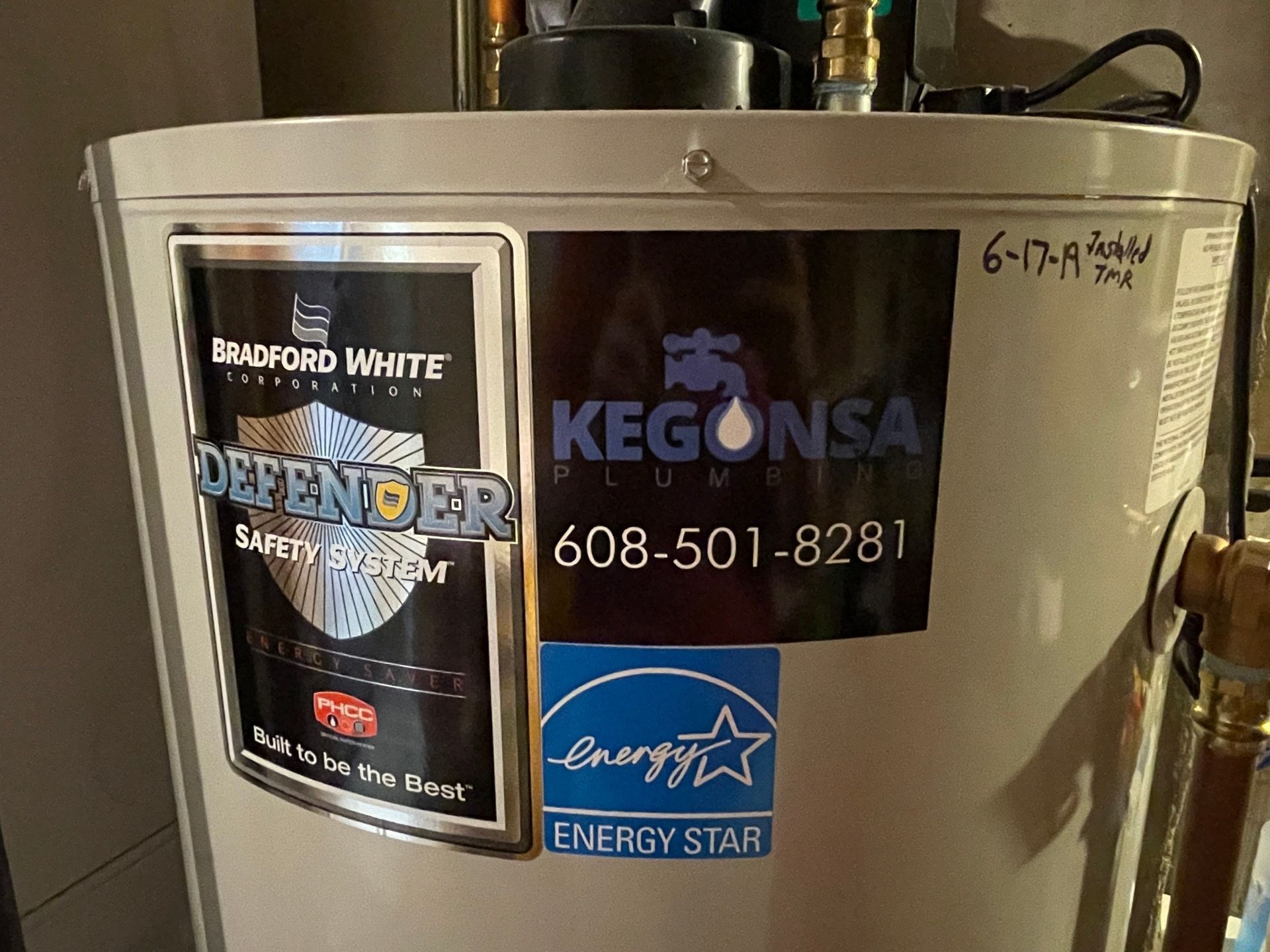 Water heater with company logos and an Energy Star label