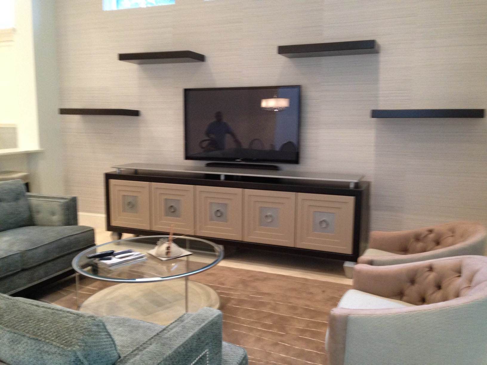 a living room with a couch and chairs , 