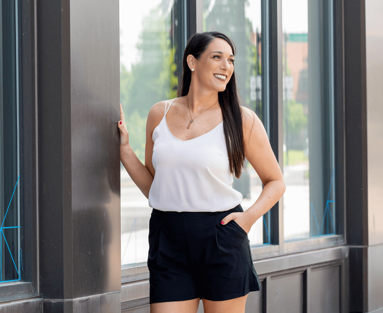 Architectural blueprints, rolled and spread out, showing detailed building plans with black lines.