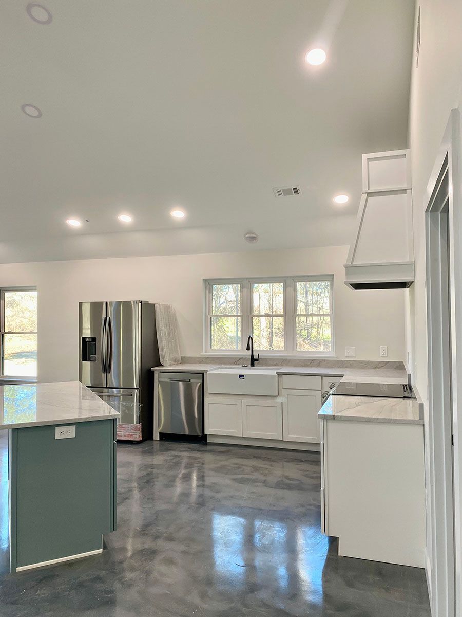 A beautiful kitchen with stainless steel appliances and white cabinets