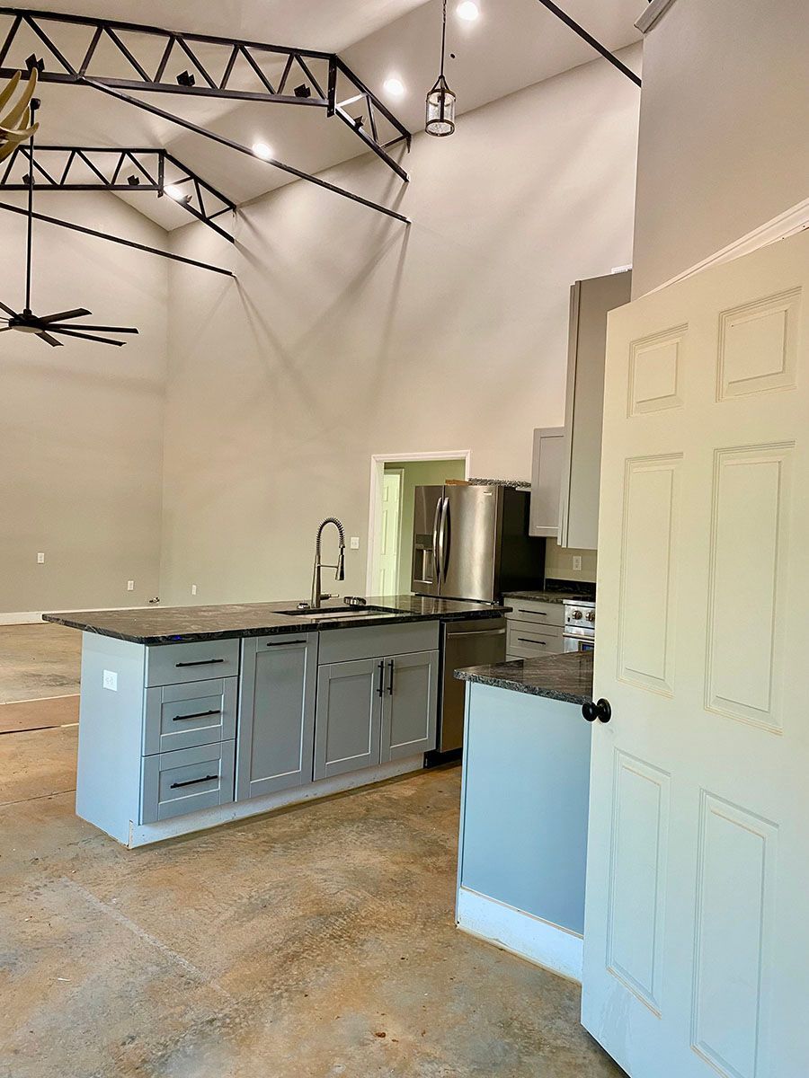 A kitchen with a ceiling fan