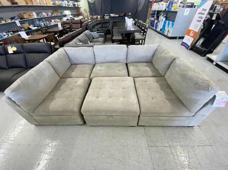 Light gray sectional sofa in a store.