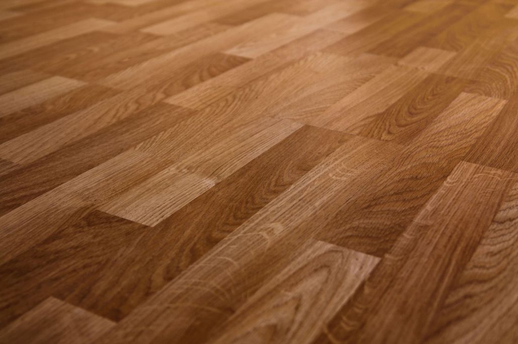 Close-up of warm-toned wood flooring with a parquet pattern