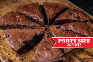 A plate of food with a sign that says party size 3 orders .