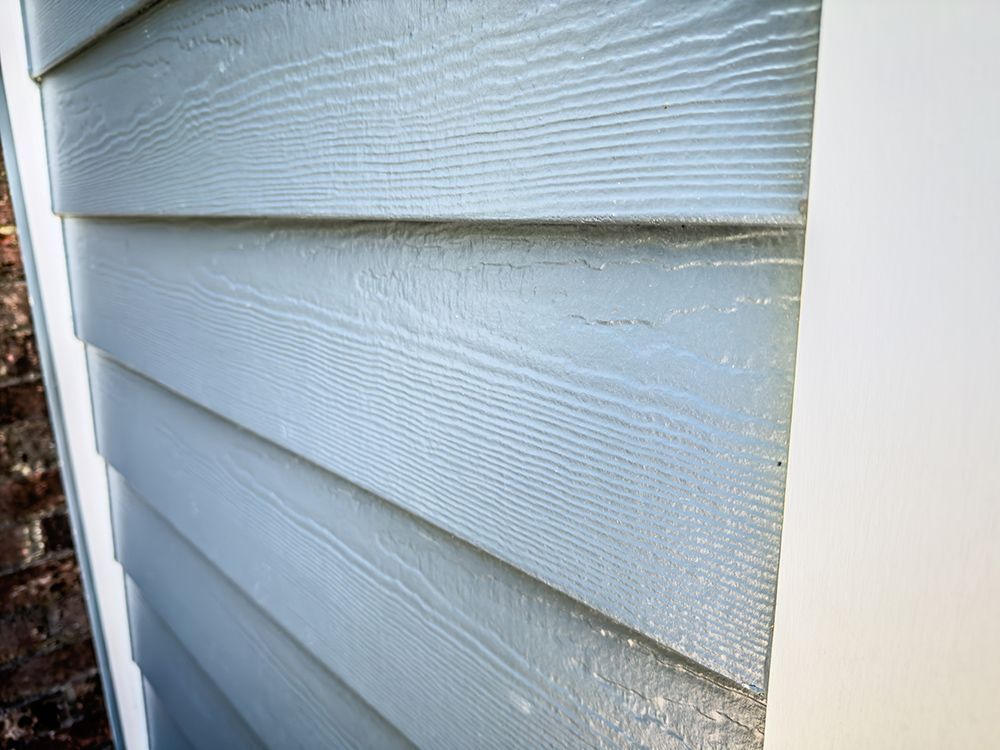 A close up of a siding on a house.
