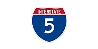 Interstate 5 highway shield, blue with a red top banner and white number 5