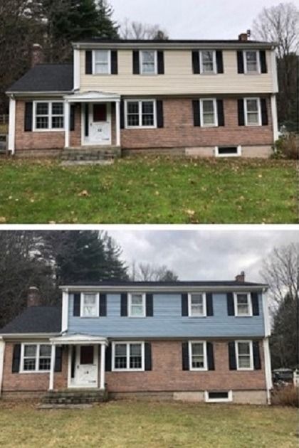 Two views of a suburban house with brick first floor and beige upper siding, before and after blue repainting.