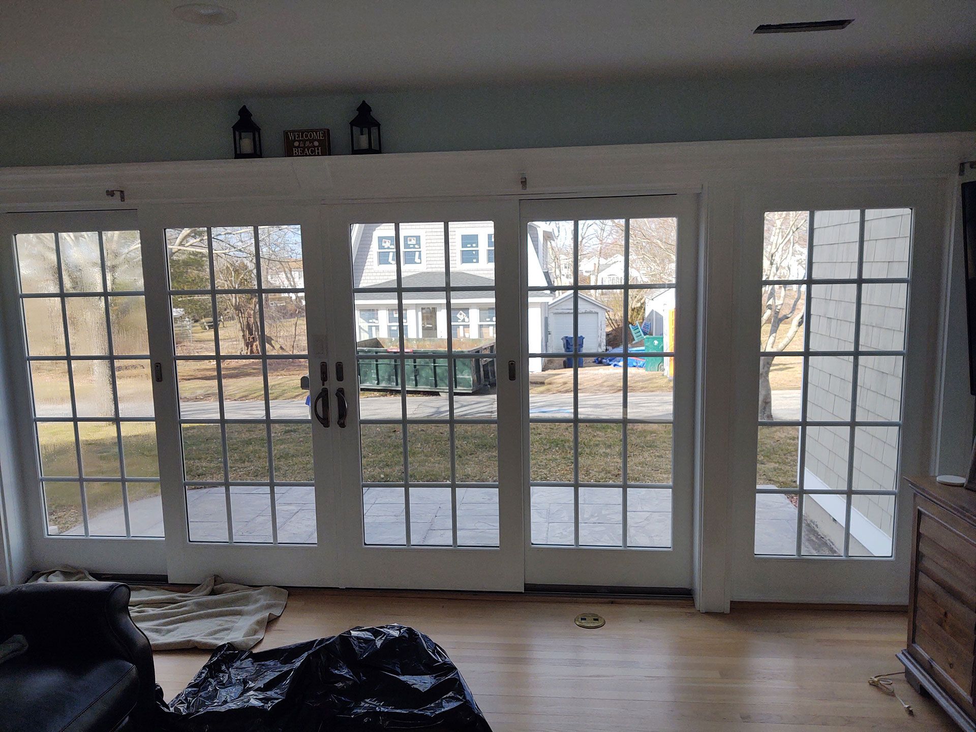 A living room with sliding glass doors leading to a patio