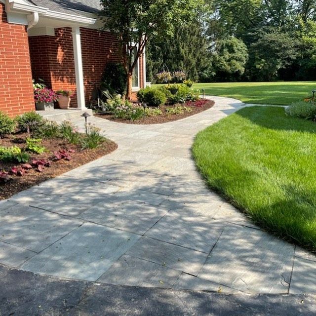 A brick house with a walkway leading to it