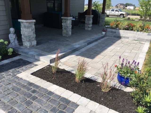 A patio with a blue potted plant in the middle of it.
