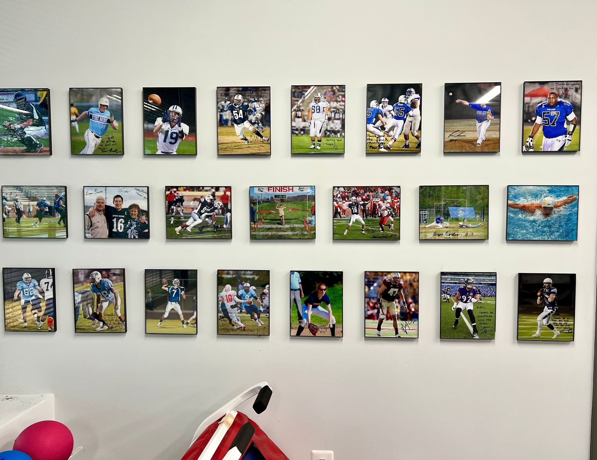A wall with a bunch of pictures of sports players on it
