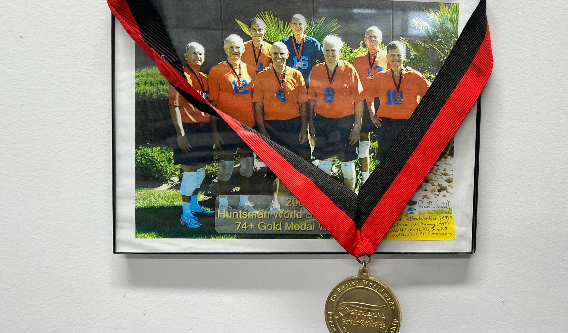 A picture of a group of people with medals around their necks