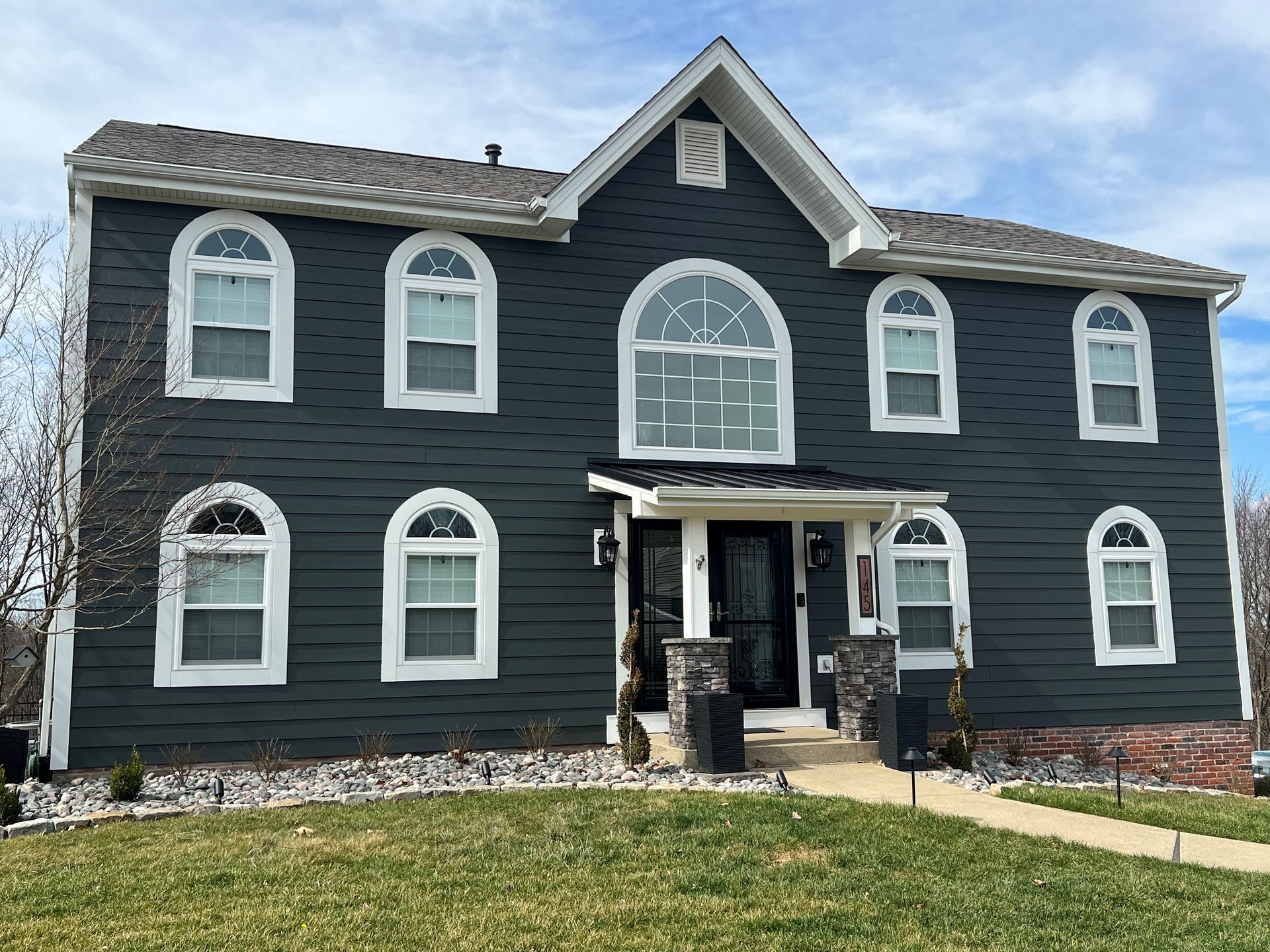 beautiful black house with white windows