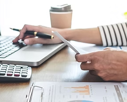Silhouette of a person, likely a woman, facing forward against a gray background.