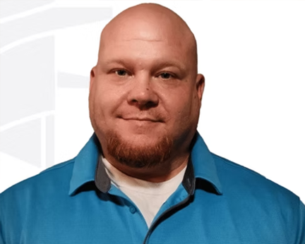 Silhouette of a person in a suit against a gray background.