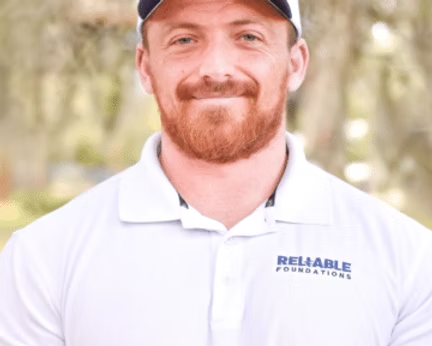 Silhouette of a person in a blazer, against a gray background.
