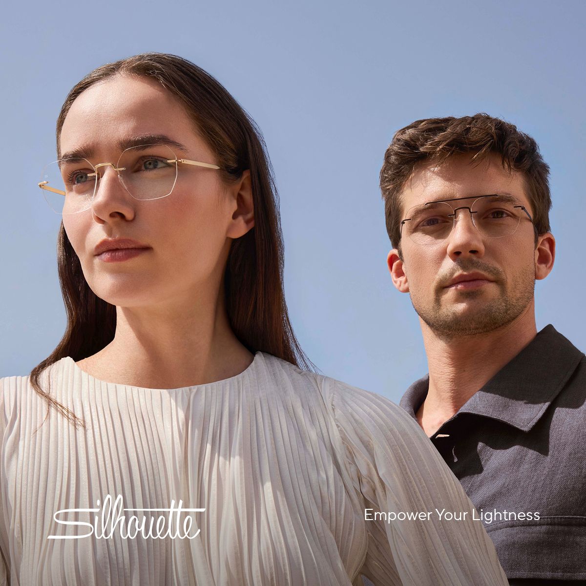 A woman and man wearing gold-rimmed glasses.