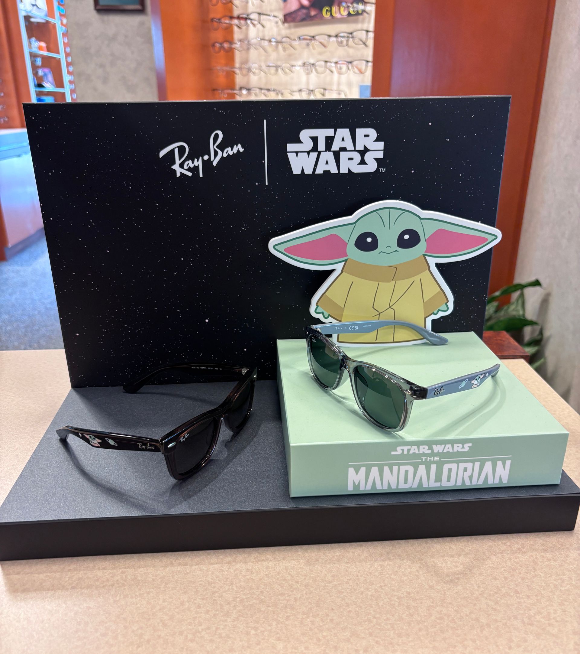 Ray-Ban Star Wars display with sunglasses and Grogu on a Mandalorian box