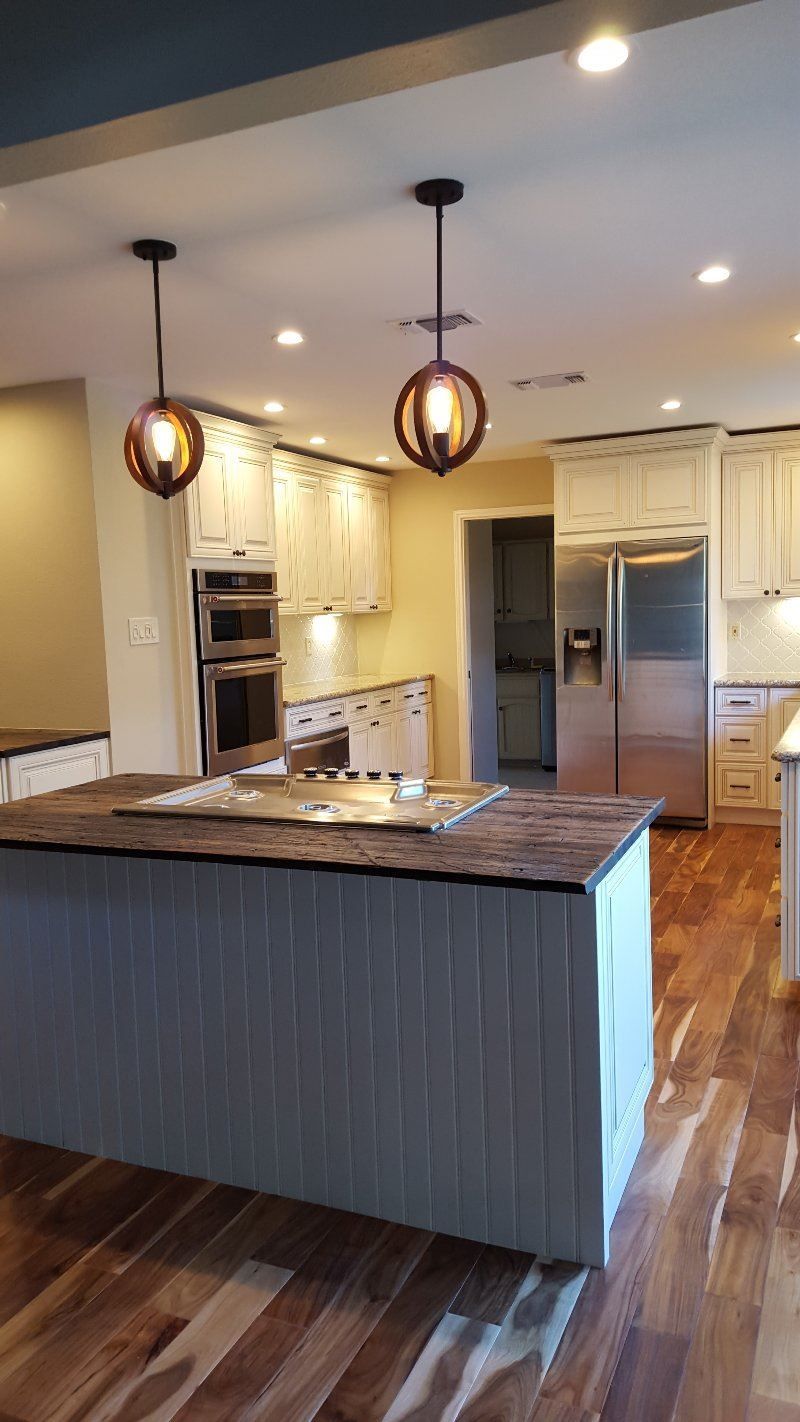 There is a large island in the middle of the kitchen.