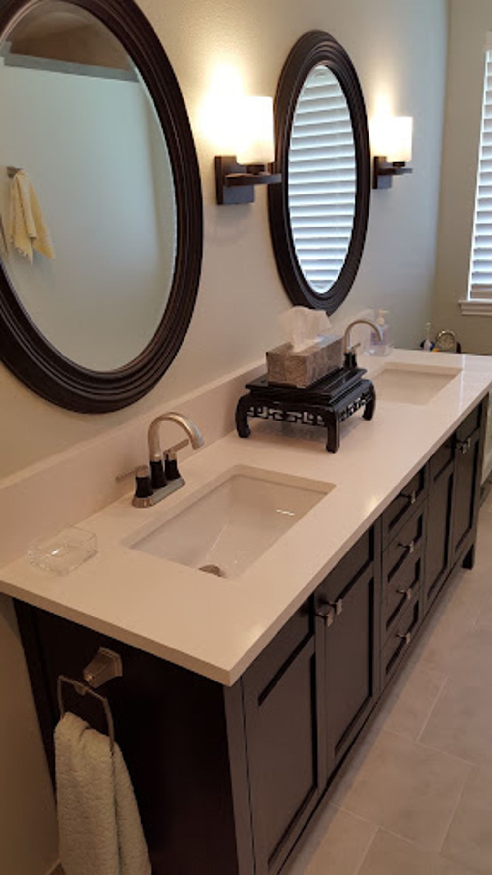A bathroom with two sinks and two mirrors.