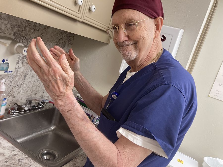 Doctor about to wash hands