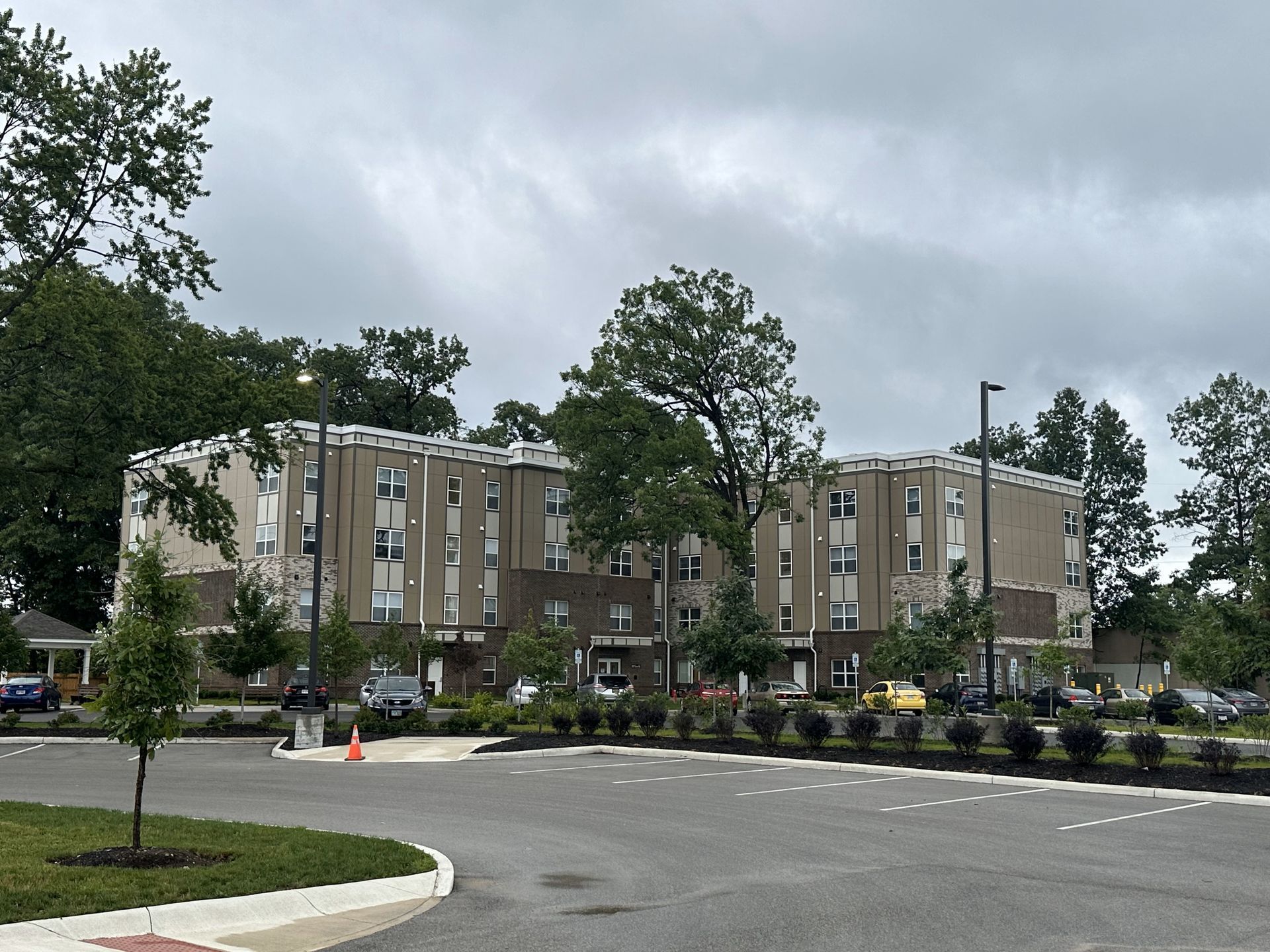 A large commercial building with a parking lot in front of it