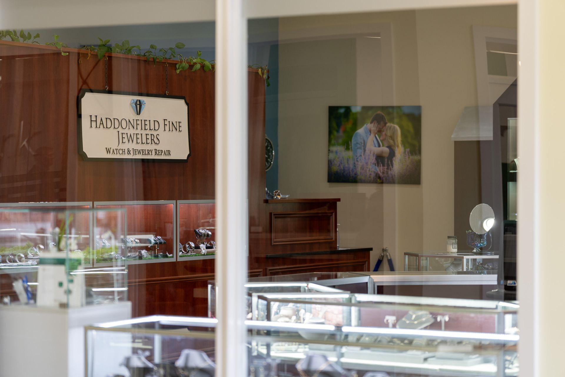 Storefront window display with glass cases and a sign reading “Hudson Fish” inside.