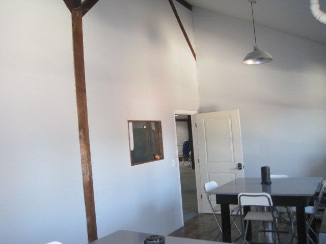 A room with a table and chairs in it