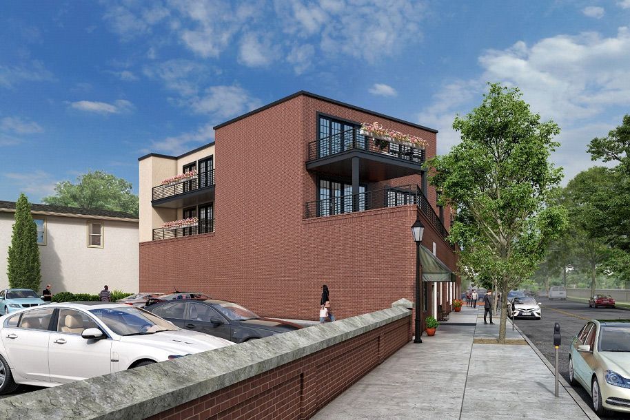 An artist's impression of a brick building with cars parked in front of it.