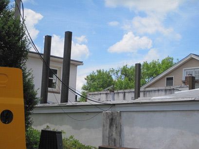 A yellow school bus is parked in front of a house