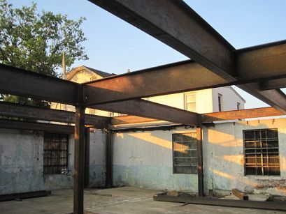 A building under construction with a lot of metal beams