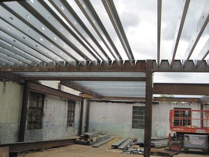 A building under construction with a metal roof