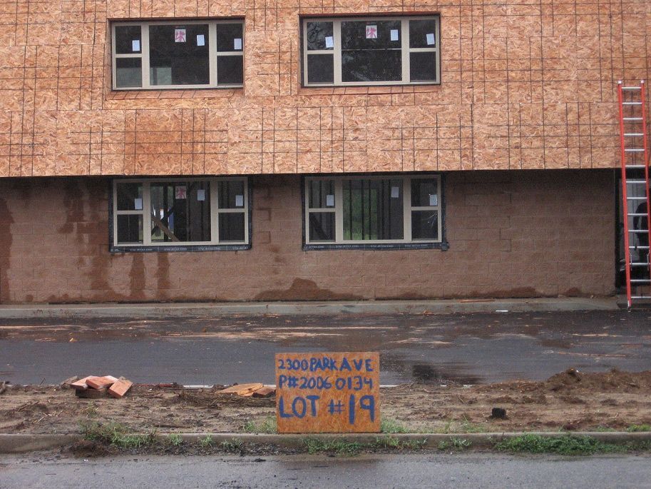 A sign on the side of a building says lot #19